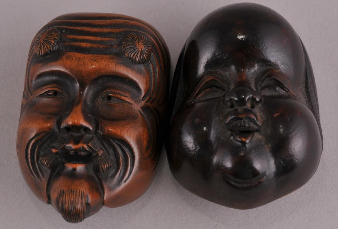 Two Japanese carved wood faced mask Netsukes. Largest- (1 of 3)