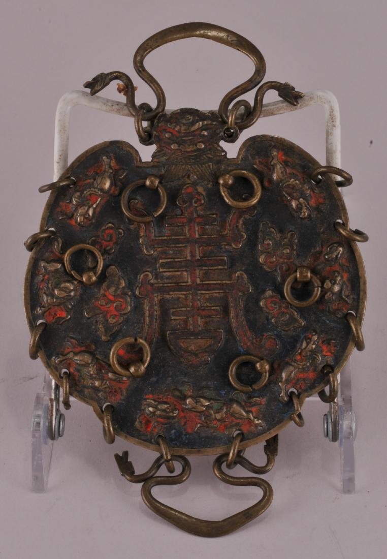 Bronze talisman. China. 19th century. Round form with (1 of 4)