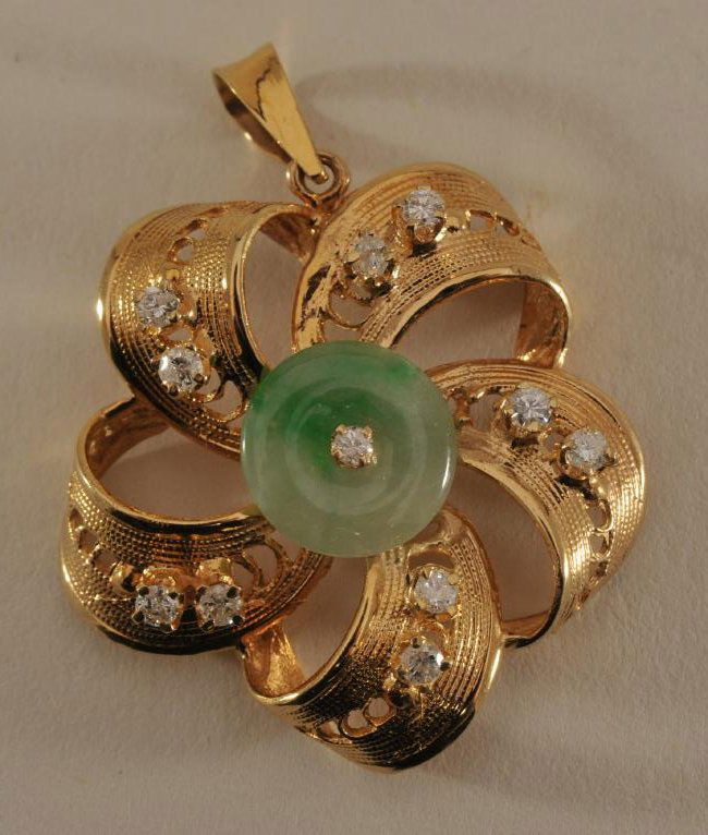 18 karat gold pin. Wheel pendant inset with diamonds (1 of 4)