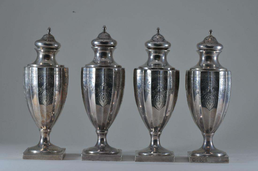 Set of four English Georgian sterling silver salt and: Set of four English Georgian sterling silver salt and pepper shakers. London makers Richard Crossley & George Smith. Date 1797-98. 7" high. 20.4 ozt. One shaker split at ribbed body meeting top. One c