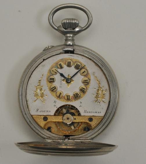 Hebdomas 8-Jours open-face pocket watch. Silver plate: Hebdomas 8-Jours open-face pocket watch. Silver plate case. Not in running condition. Roman numeral markers, with blued hands. Silver dial, with gold accents. Case features bird and flower motifs. Fro