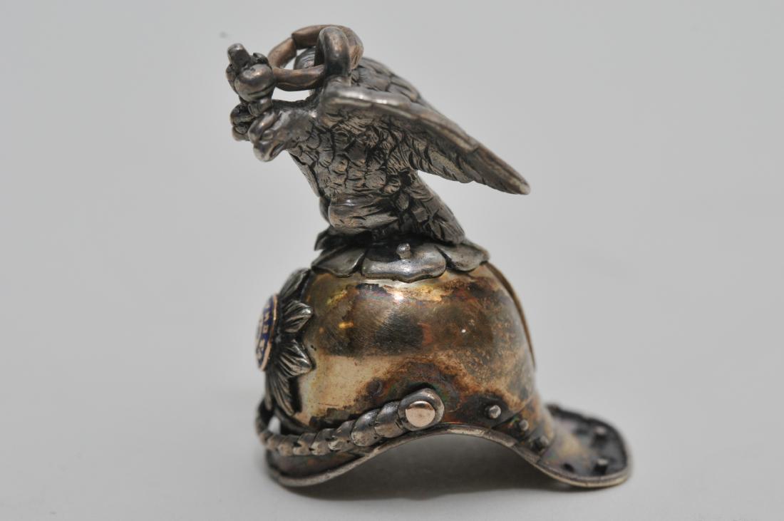 Rare small Russian silver Imperial helmut form charm.: Rare small Russian silver Imperial helmut form charm. Similar pieces are attributed to Faberge. Made for a son of Nicholas II. Russian form helmut with Imperial eagle and crown finial. Enameled on blu