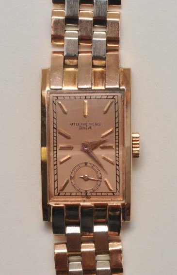 Patek Philippe 'Tegolino' 18k Rose Gold men's wrist: Patek Philippe 'Tegolino' 18k Rose Gold men's wrist watch. Tank shape, 'curvex' style case. Beveled acrylic crystal. Caseback with crisp hallmarks on inside, numbered 625185. Rose and white gold link