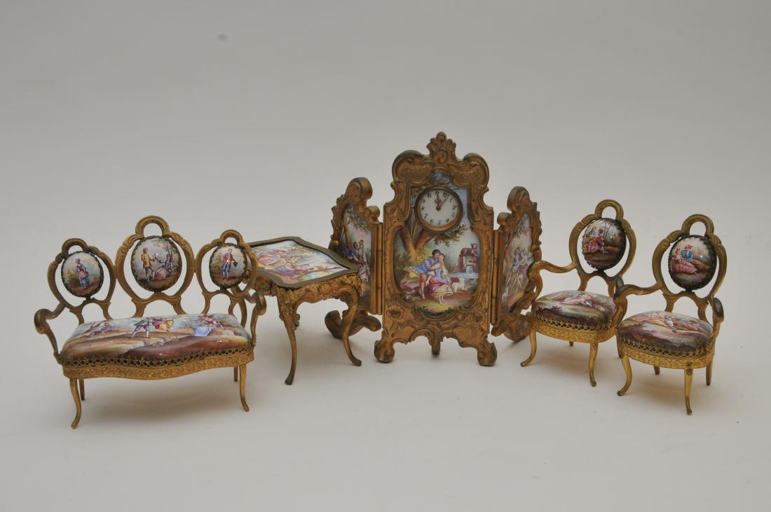 19th century Viennese gilt bronze miniature suite of: 19th century Viennese gilt bronze miniature suite of furniture and three panel folding screen clock. Each piece decorated with enamel painted Romantic scenes. (1) Small one draw turtle top table. 4" w