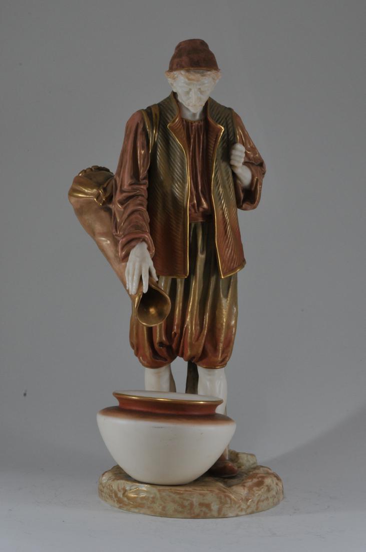 Royal Worcester porcelain standing figure of a man: Royal Worcester porcelain standing figure of a man wearing a fez pouring into a large vessel. Gilt highlights. Signed Hadley on back post. Large water pot has separate liner. 12-1/2" high. Tape mark o