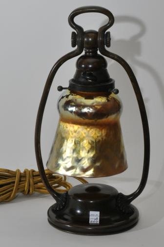 Tiffany Studios bronze desk lamp #21710 with gold: Tiffany Studios bronze desk lamp #21710 with gold quilted pattern art glass Aurene shade. Base signed and numbered on bottom. Shade signed "L.C.T." inside top rim. Top rim with polished finish. Shade 