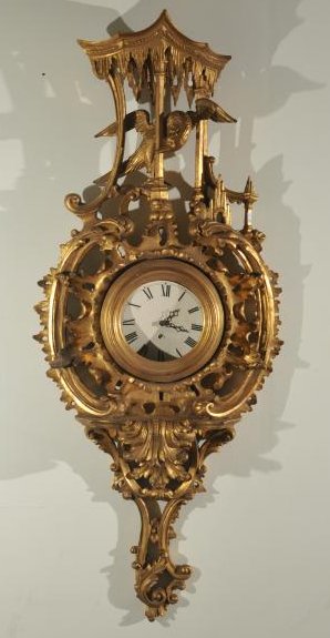 Chinese Chippendale style carved and gilt wall clock: Chinese Chippendale style carved and gilt wall clock with Waltham Works movement. Carved pagoda with bird and floral scrolls. Clock working but needs to be reset in place and new dial. Repair to left 