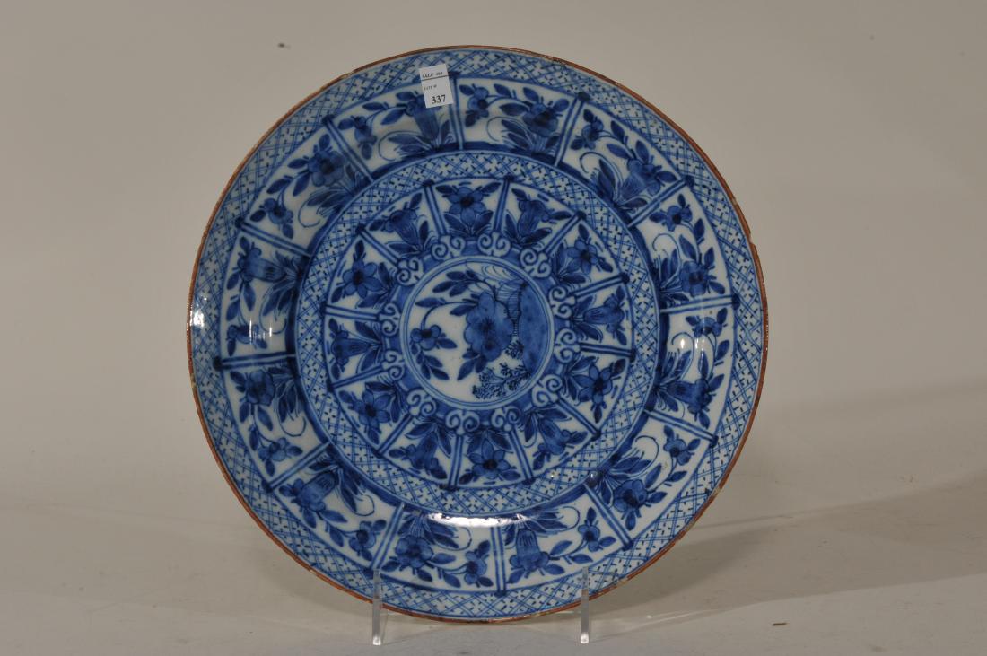 17th century Dutch Delft pottery plate with blue and: 17th century Dutch Delft pottery plate with blue and white floral decoration. AIK mark on reverse. Inscription- "Albrecht and Jacob DeKeyser 1660. Old Hold Delft". Rim chips. 10-1/4" diameter.
