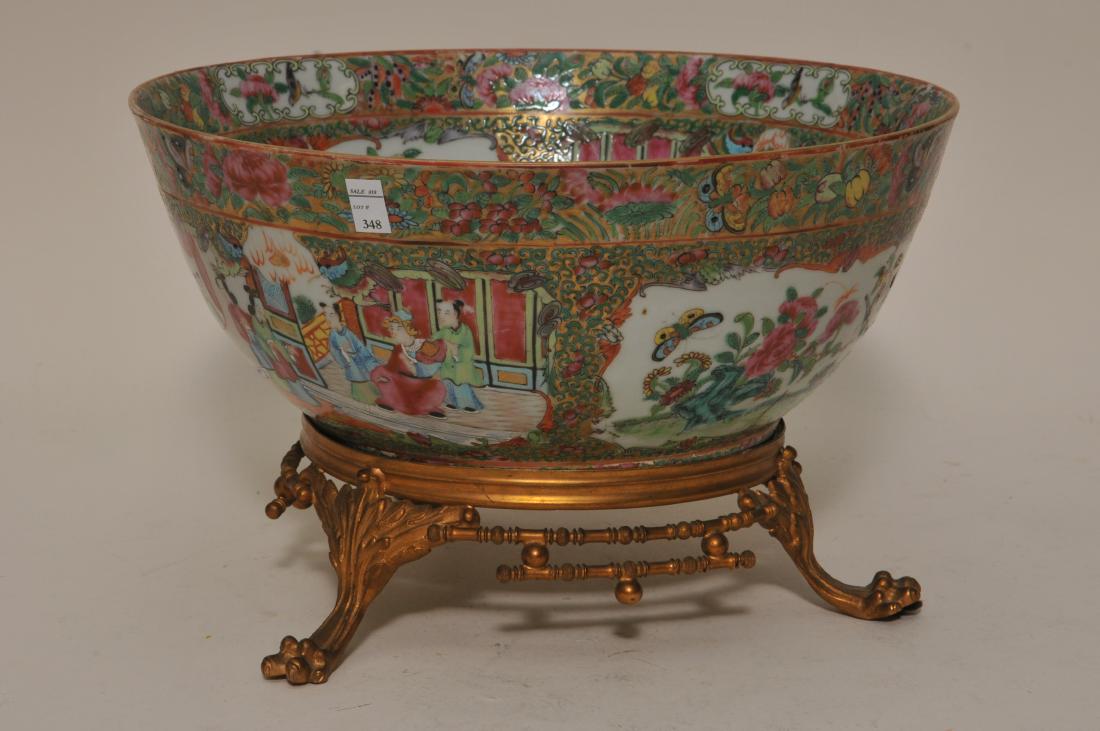 19th century Chinese Famille Rose porcelain punch bowl: 19th century Chinese Famille Rose porcelain punch bowl with Rose Medallion decoration. Plastered into a gilt bronze claw footed base. Good condition. Minor loss and as made imperfections to decoration