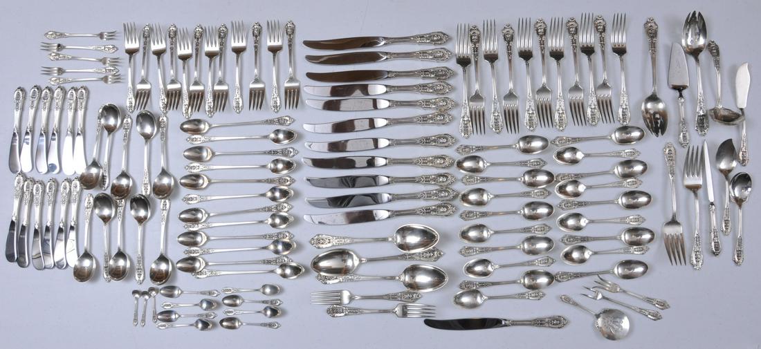 Wallace "Rose Point" 122 piece sterling silver flatware: Wallace "Rose Point" 122 piece sterling silver flatware set. Includes: (12) knives- eleven at 9-3/4" one at 9-1/4". (12) butter knives- 6-1/8". (12) ice tea spoons- 7-5/8". (19) teaspoons- 6". (10) cr