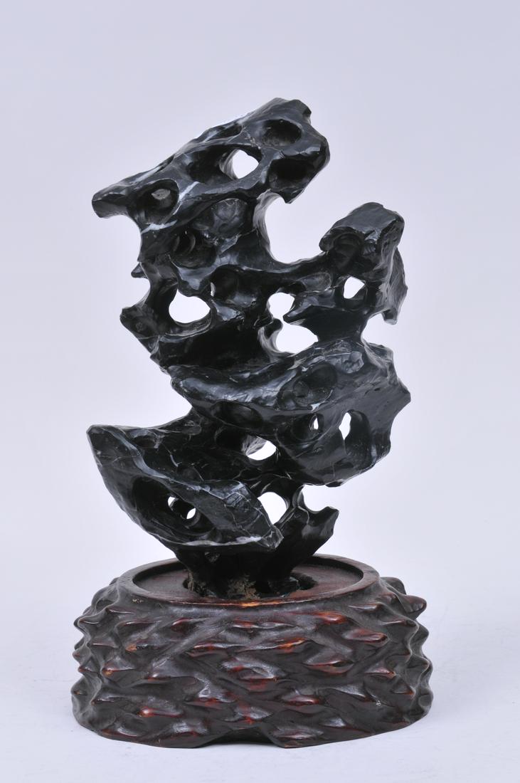 Scholars stone. China. Ling Pi t type. Carved hardwood: Scholars stone. China. Ling Pi t type. Carved hardwood stand. Overall with stand- 12" high.
