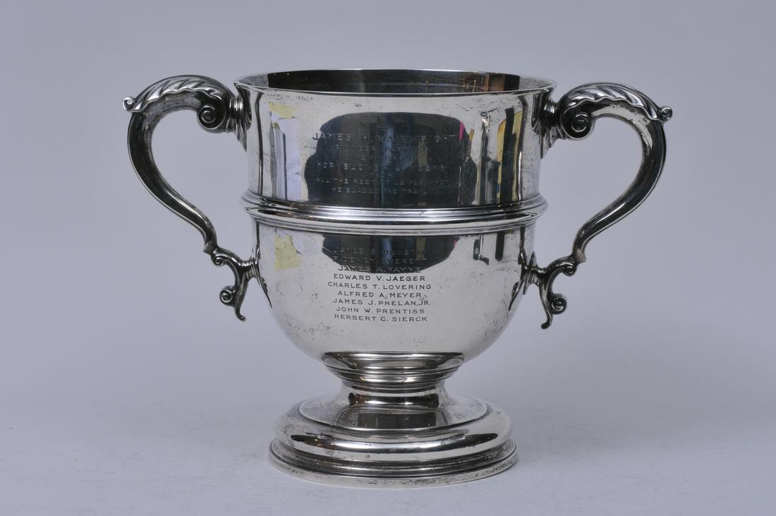 English sterling silver two-handled trophy. Presented: English sterling silver two-handled trophy. Presented to "James H. Wainwright. Pioneer Partner in Hornblower & Weeks". Hallmarked on body near handle. London 1917. Marked on base- Made in England for 