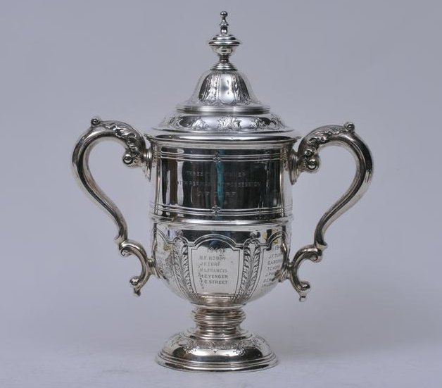 Reed and Barton sterling silver covered two handled: Reed and Barton sterling silver covered two handled trophy. Raised leaf and vine design. "Board of Governors Trophy. The Traffic Club of New York" "Three time Winner J.F. Turf" 1945 Last date. 13-1/2"