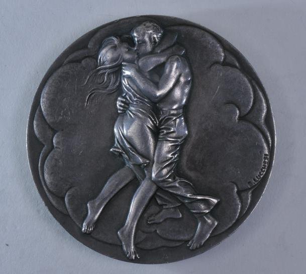 Silver Medal. Couple Embracing and Mother and Baby on: Silver Medal. Couple Embracing and Mother and Baby on reverse. Signed Bruno Lucchesi, 1975. Marked on rim "The Society of Medalists. 92nd Issue. October 1975". .999 silver. 2-3/4" diameter. 11.3 ozt.