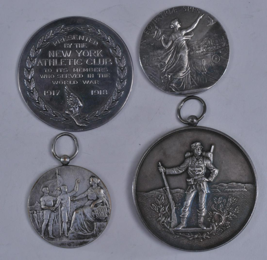 Lot of four WWI silver medals. (1) Standing soldier.: Lot of four WWI silver medals. (1) Standing soldier. Engraved in French on back. 2-1/8" diameter. 4.8 ozt. (2) 1918 medal presented by "The New York Athletic Club to its members who served in the Worl