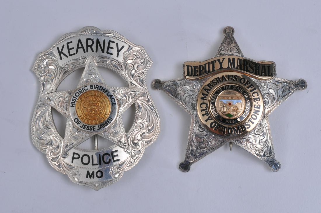 Two sterling silver limited edition law badges. (1): Two sterling silver limited edition law badges. (1) Kearney Police Star badge. Lawman Badge Co. 12/400. (2) City of Tombstone Deputy Marshall Star badge. Lawman Badge Co. #171.