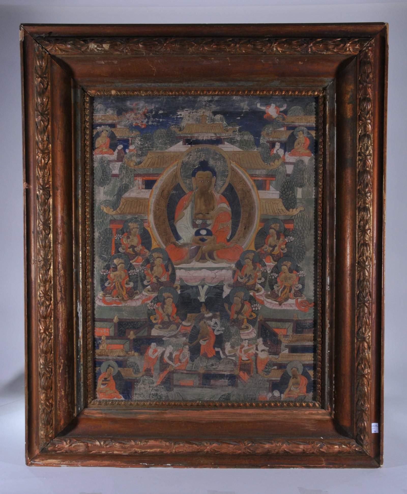 Thangkha. North China or Mongolia. Late 19th C. Ink and: Thangkha. North China or Mongolia. Late 19th C. Ink and colours on heavy cloth. The Medicine Buddha surrounded by lineage figures. 24" x 18-3/4". Framed.