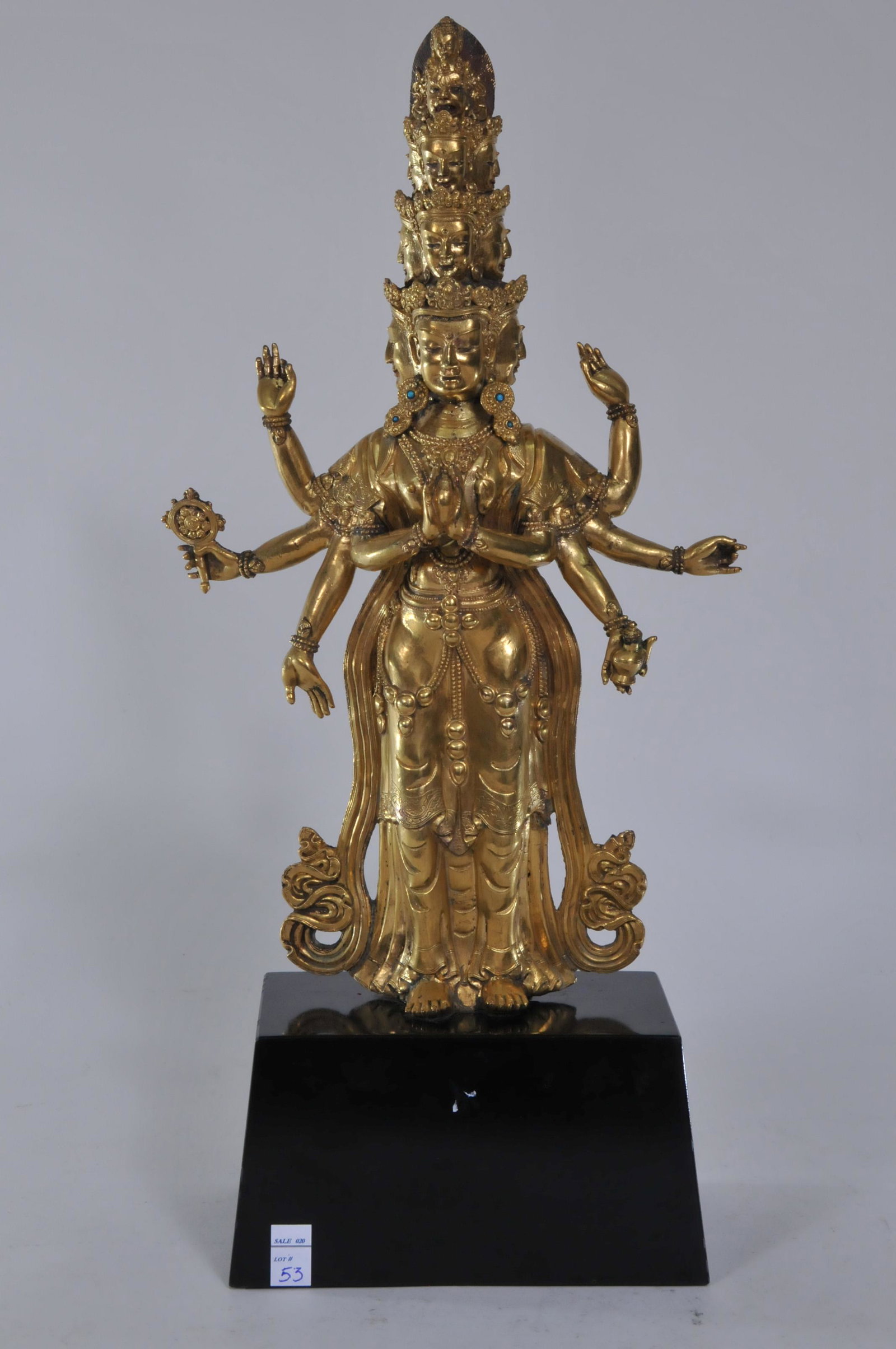 Gilt bronze Buddhist image. Tibet. 17th/18th C. Figure: Gilt bronze Buddhist image. Tibet. 17th/18th C. Figure of Ekadasuralokeshvara. Turquoise inlays. 12-3/4"H.