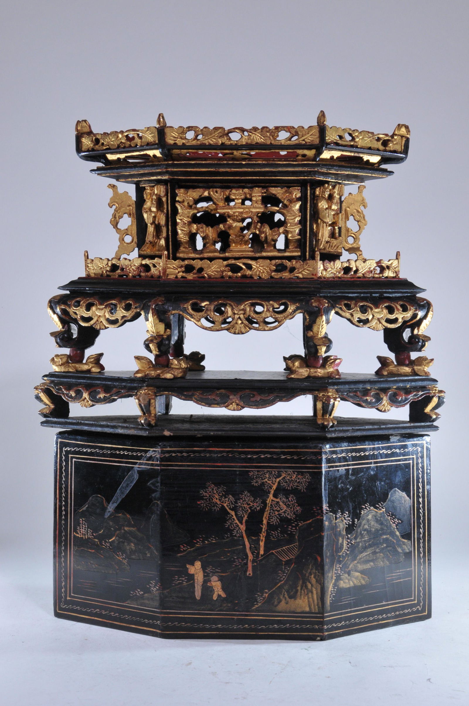 Lacquered shrine. China. Early 20th C. Carved and: Lacquered shrine. China. Early 20th C. Carved and pierced. Surfaces decorated in black, red and gold lacquer. 14" x 11". Loss to lacquer. Heavy losses to top of shrine box.