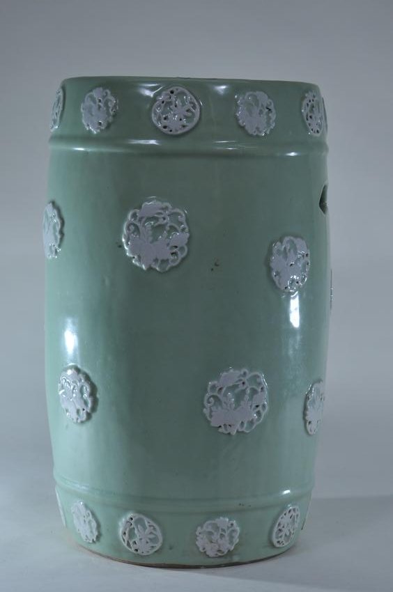 Porcelain garden seat. Japan. Meiji period (1868-1912).: Porcelain garden seat. Japan. Meiji period (1868-1912). Celadon ground with white relief brocade roundels. 19"H.