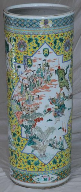 Porcelain umbrella stand. China. 19th C. Cylindrical: Porcelain umbrella stand. China. 19th C. Cylindrical form. Famille verte decoration of figures on a floral scroll yellow ground. 24"H.
