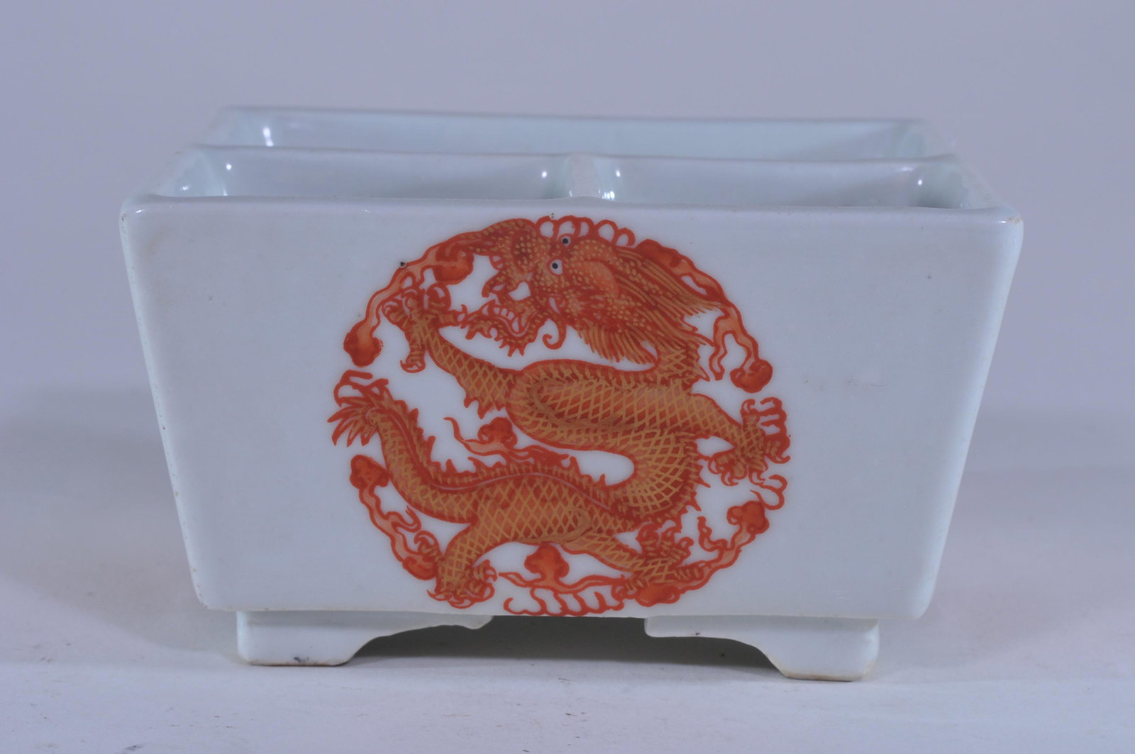 Porcelain shaped dish. China. 19th C. Square form with: Porcelain shaped dish. China. 19th C. Square form with three compartments. Decoration of iron red and gilt roundels of phoenixes. 4-1/4" x 4-1/4" x 2-1/4". Tung Chih mark.