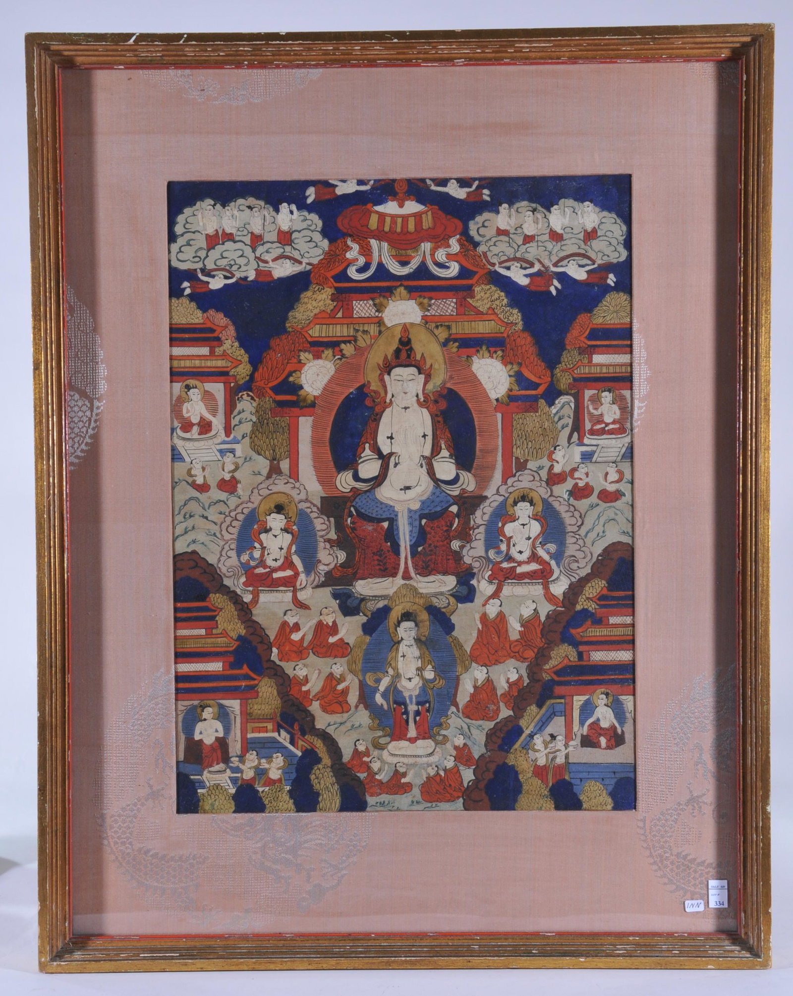 Buddhist Icon. North China or Tibet. Circa 1900. Ink: Buddhist Icon. North China or Tibet. Circa 1900. Ink and colours on heavy cloth. Thangkha of The White Tara surrounded by lineage figures. 18-1/2" x 12-1/2". Framed and glazed.