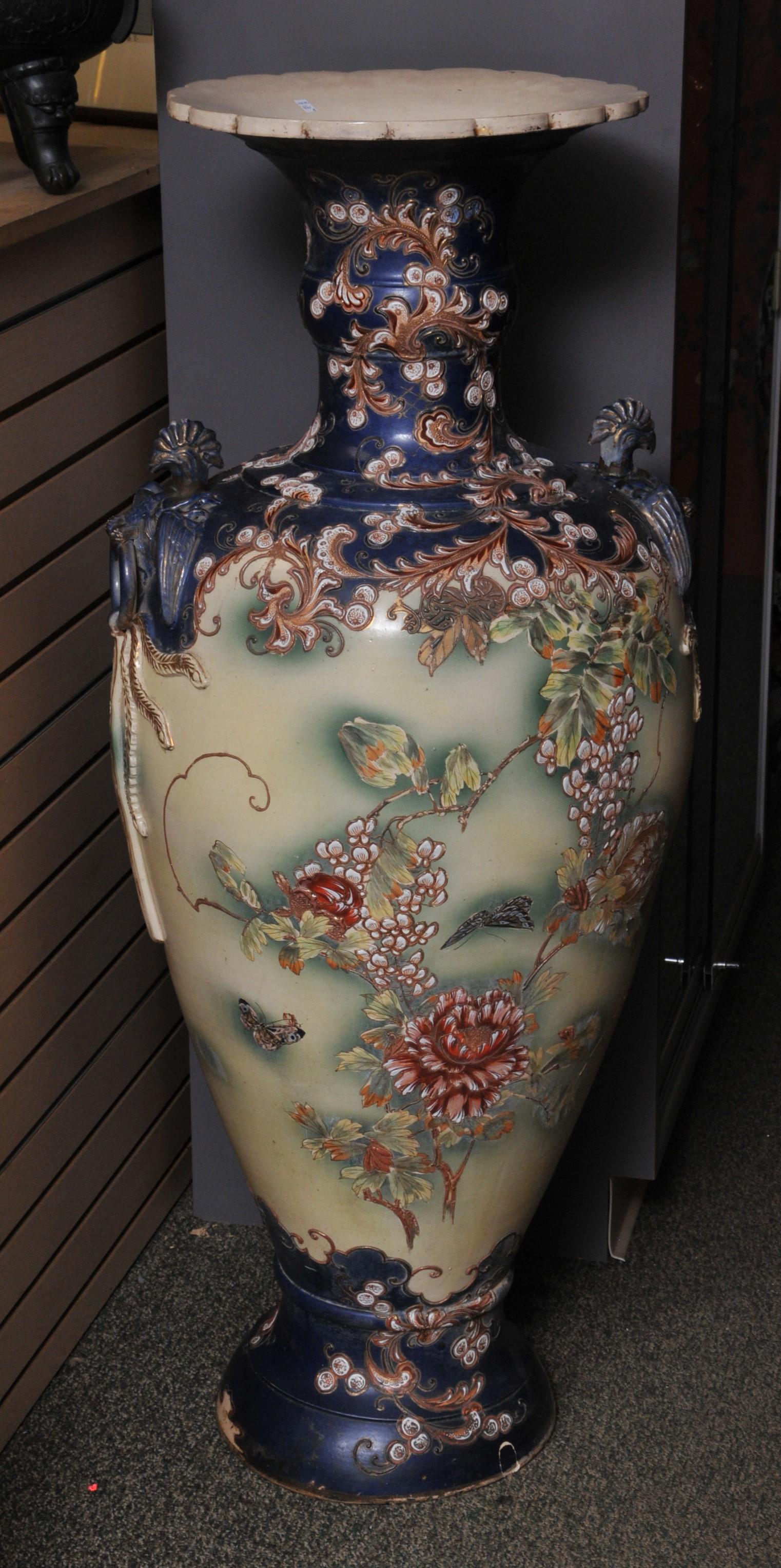 Pottery palace vase. Japan. Meiji period (1868-1912).: Pottery palace vase. Japan. Meiji period (1868-1912). Satsuma ware. Phoenix handles. Moriage decoration of flowering vines. 49"H. From the estate of Frank Giuffrida. Late owner of the famous Hilltop S