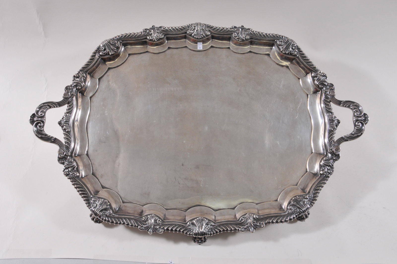Monumental Gorham sterling silver Special Order two: Monumental Gorham sterling silver Special Order two handle tray. Raised leaf and scroll gadrooned border. Leaf decorated handles. Large claw feet. Presentation inscription on base. "Presented to Willi