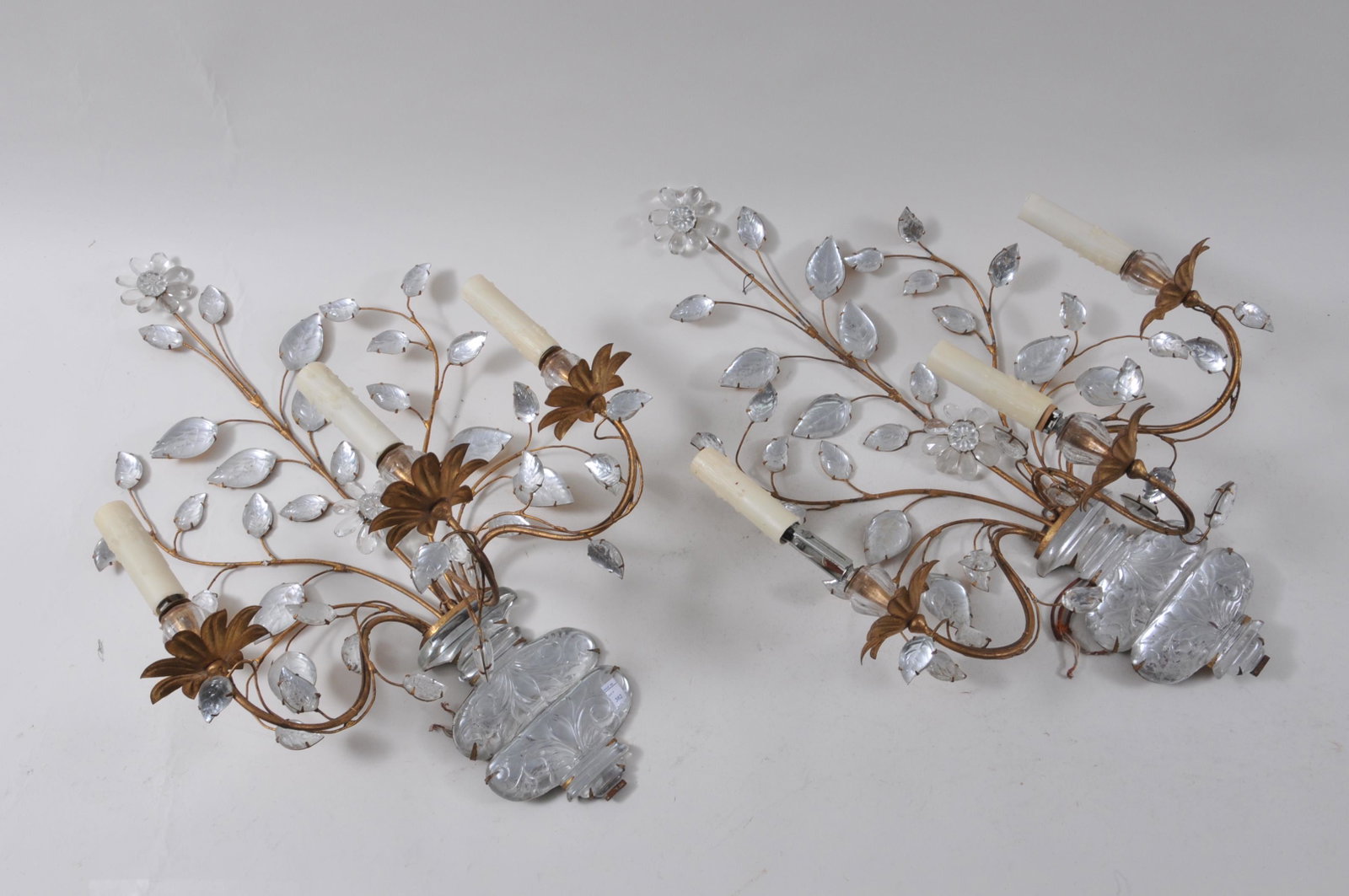Pair of early 20th Century Continental wire work: Pair of early 20th Century Continental wire work sconces with rock crystal decorations in the form of a vase with vines, leaves and flowers. Each with three electrified candle lights. Height 26”. Wi