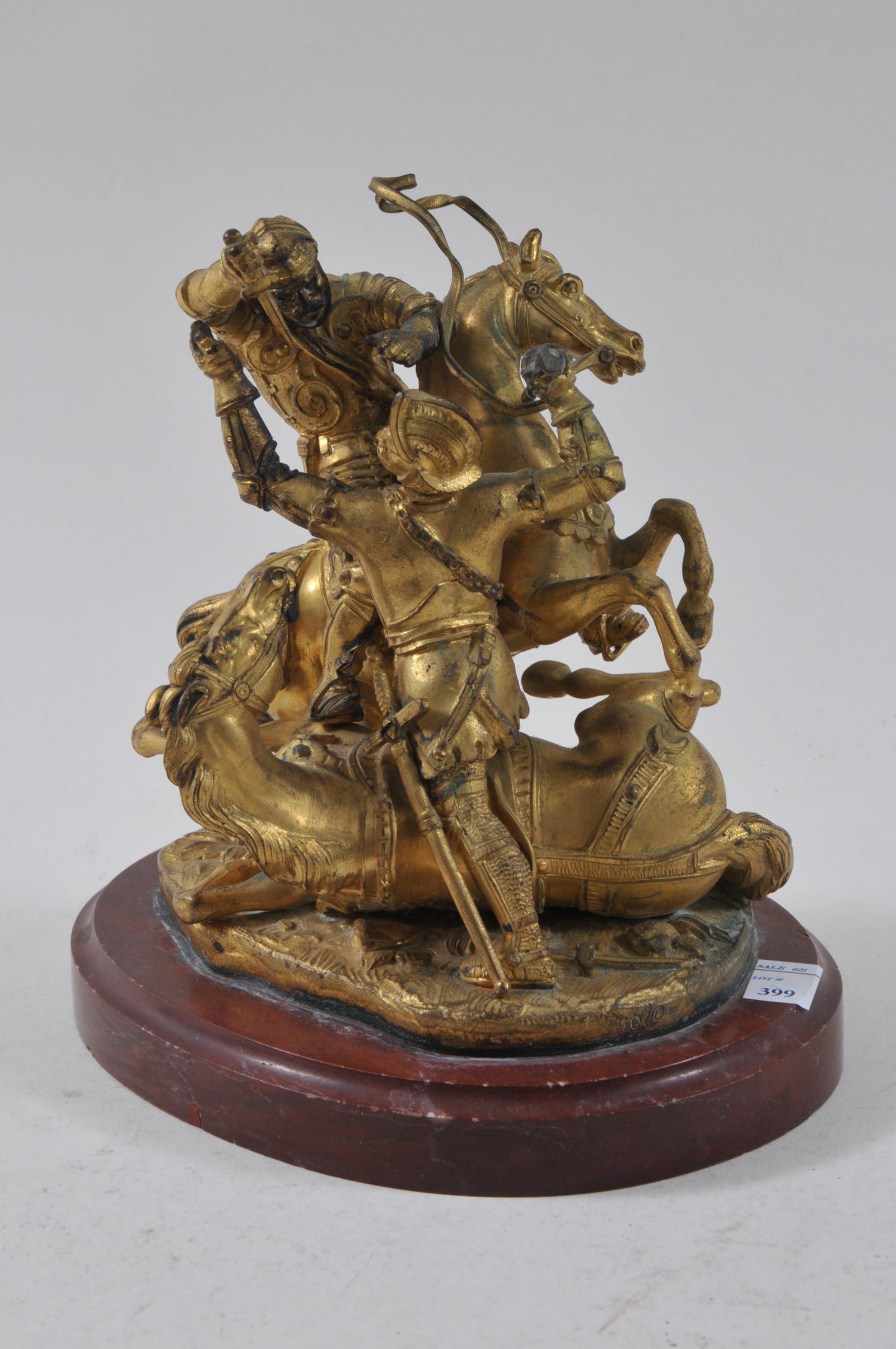 19th century gilt bronze figure of two knights on: 19th century gilt bronze figure of two knights on horseback battling each other. Removable knight with dagger. Signed on bottom of pants. Poss. Russian. Individual sharp spurs. Rouge marble base. 7" h