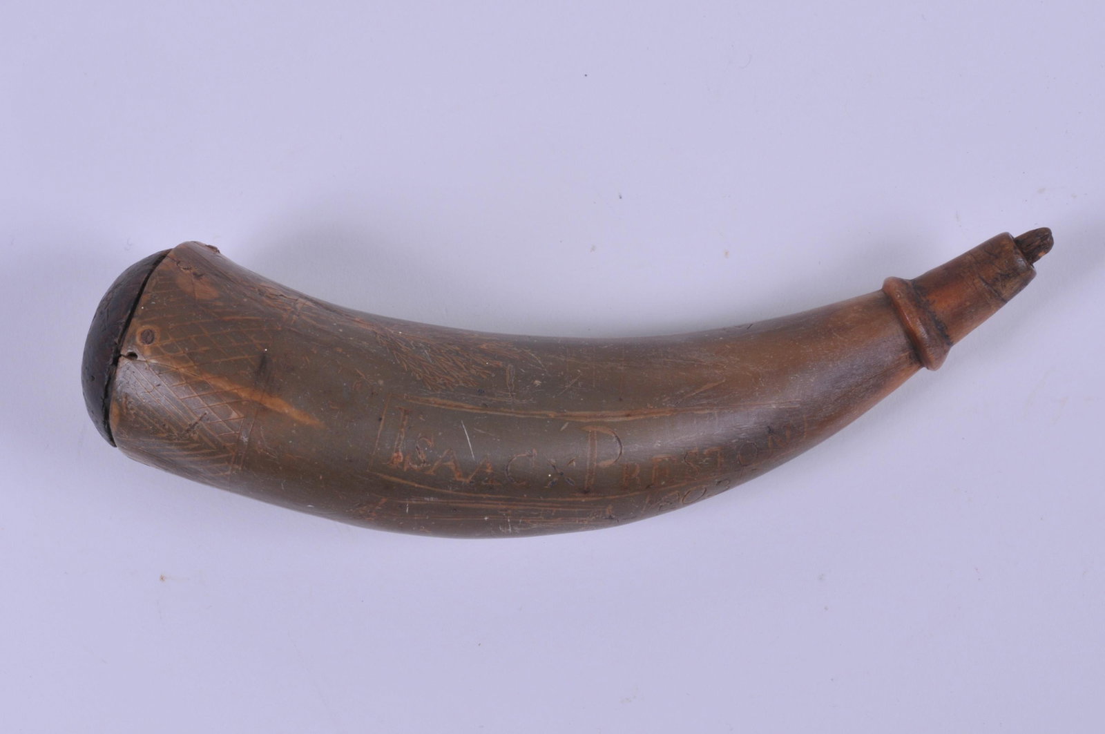 Early Powder Horn I'd to Issac Preston dated 1803.: Early Powder Horn I'd to Issac Preston dated 1803. Engraved with a Two Masted Sloop having 10 Guns, a Federal Eagle, a Pine Tree, and a Mans Head. Original plug end and stopper. 7-1/2" overall. Cracki