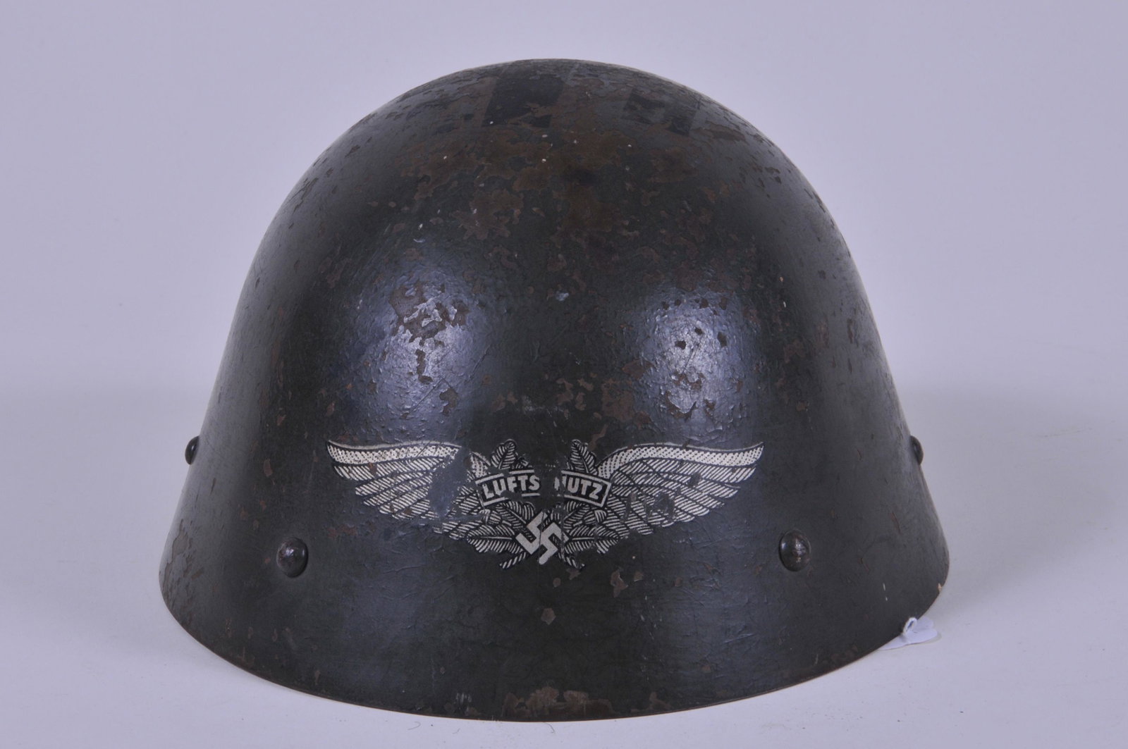 WWII German Reissue Czech M34 Luftschutz Helmet Green: WWII German Reissue Czech M34 Luftschutz Helmet Green color with original liner and chin strap. One liner strap is torn.