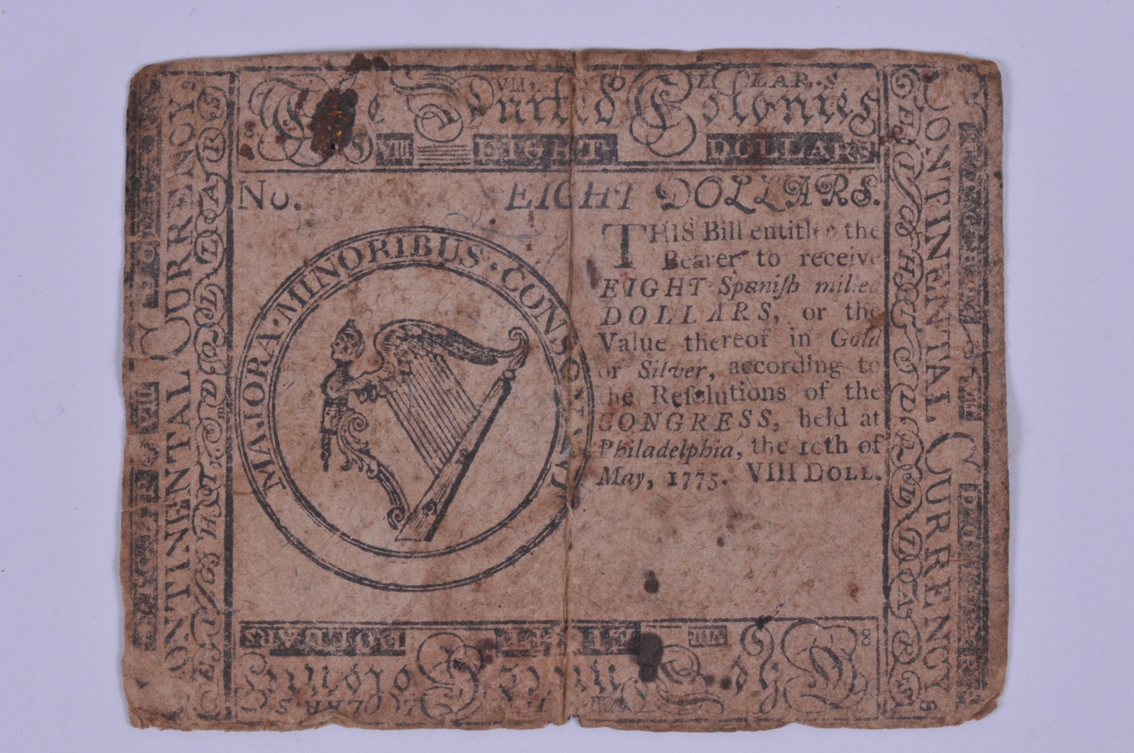 May 1775 $8 Dollar Continental Spanish Milled Currency: May 1775 $8 Dollar Continental Spanish Milled Currency printed by Hall and Sellers Philadelphia. Nice Revolutionary War era item. Condition: Wallet fold crease and signature ink fade.