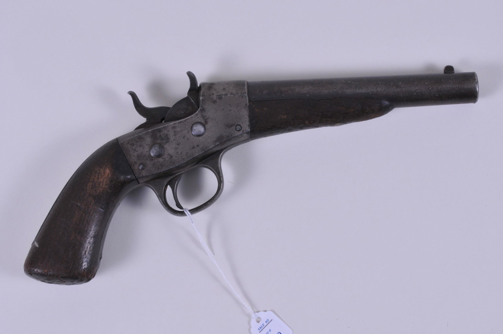 Post Civil War Navy Rolling Block Pistol serial# 3267: Post Civil War Navy Rolling Block Pistol serial# 3267 with crisp inspection cartouches and an anchor on BBL breech. Heavy use weapon with rust in bore and chips at butt and bruising of wood. Action wo