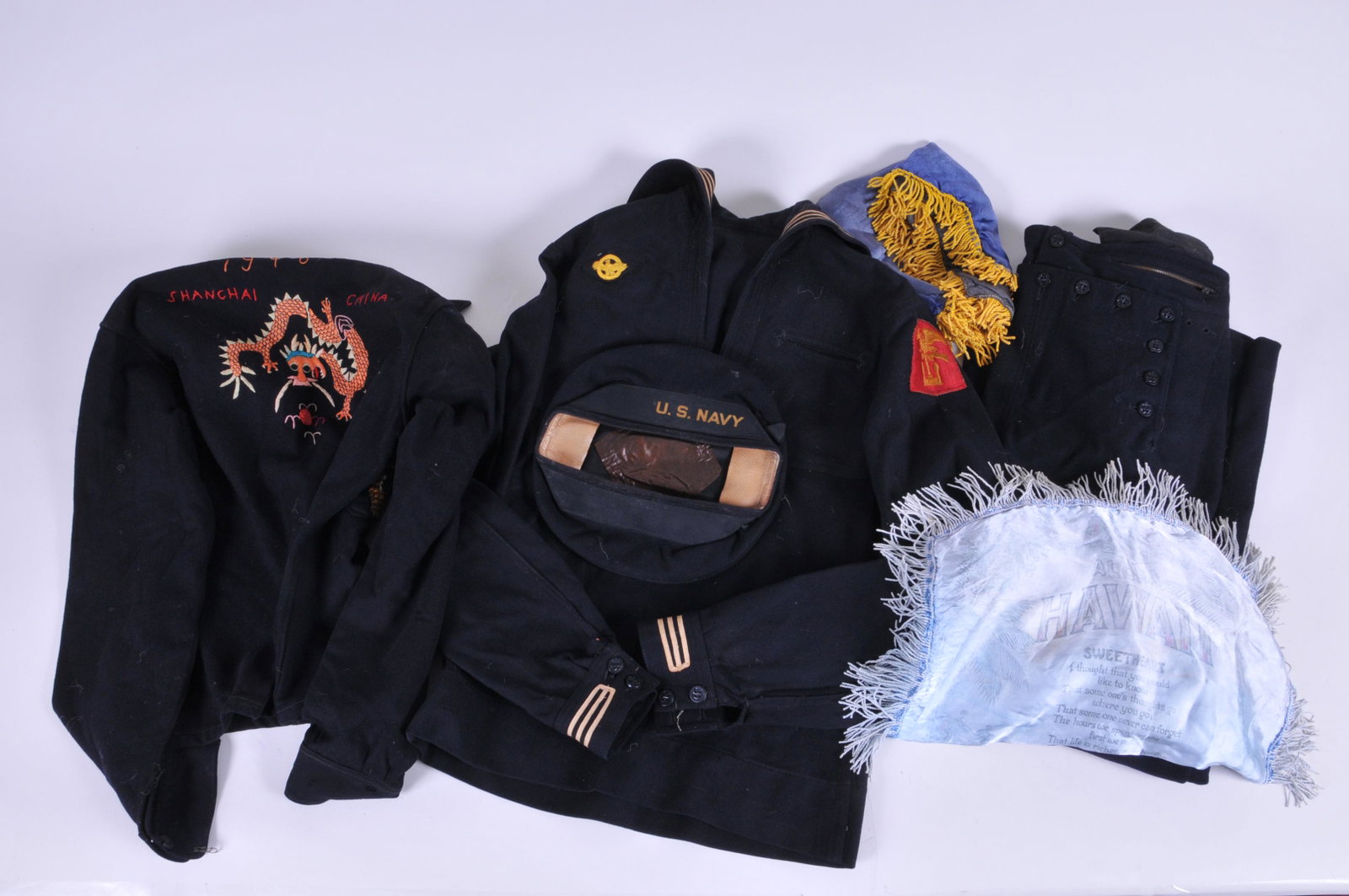 Scarce WWII U.S. Naval Amphibious Forces lot of items: Scarce WWII U.S. Naval Amphibious Forces lot of items I'd to H.R. Kershner and L.W. Warren. A Jumper shirt with patch, Pants, Dragon stich work jacket dated 1946, two souvenir silks and a Hat.