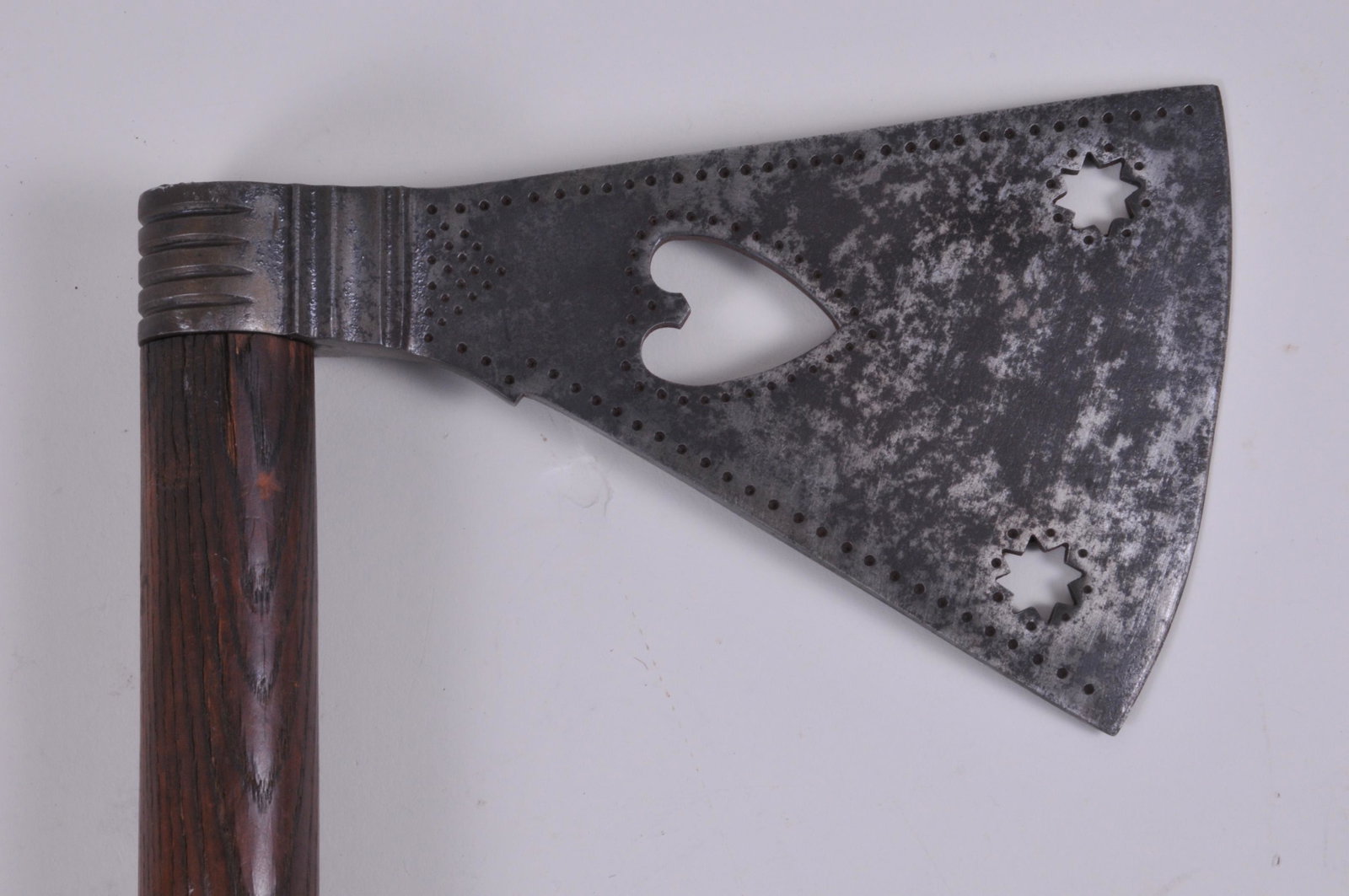 Nice Example Plains Indian Pierced Large Ax Head with a: Nice Example Plains Indian Pierced Large Ax Head with a Centered Heart and two 8 pointed Stars. Punch decorated around edges and symbols with a step baluster and 4 grooved haft ring. The iron head mea