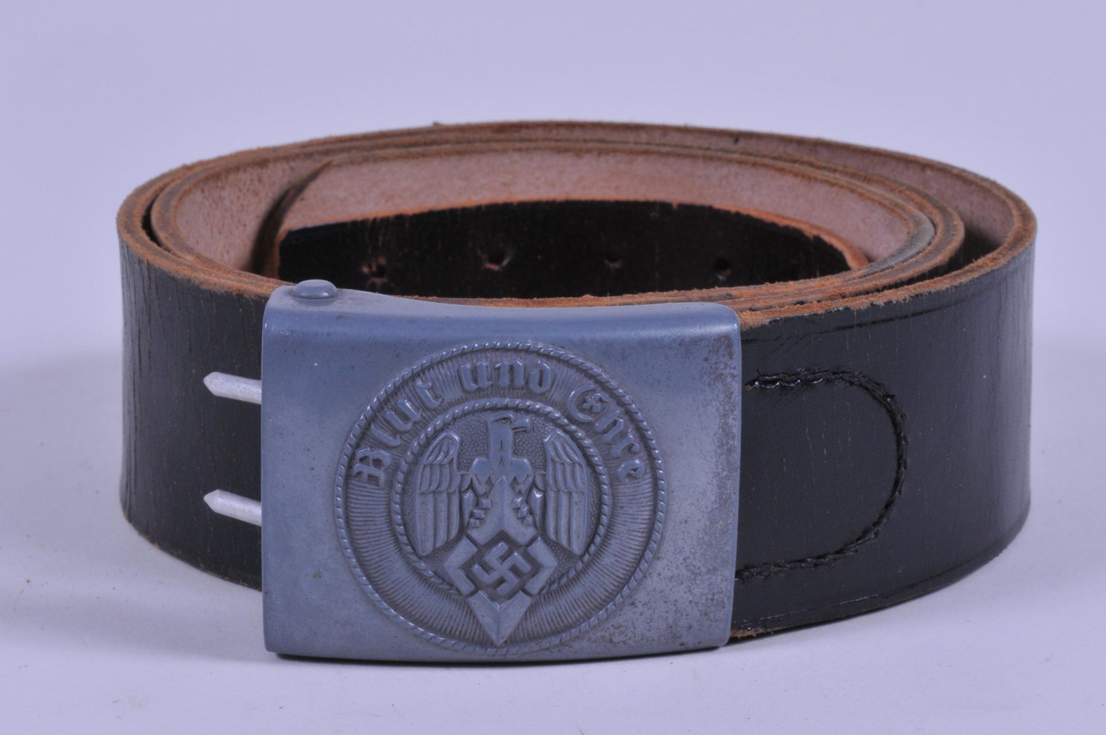 WWII German Hitler Youth Belt Buckle with original: WWII German Hitler Youth Belt Buckle with original leather belt and clip. Marked "RZM M 4/23" on the reverse of buckle. Great condition.