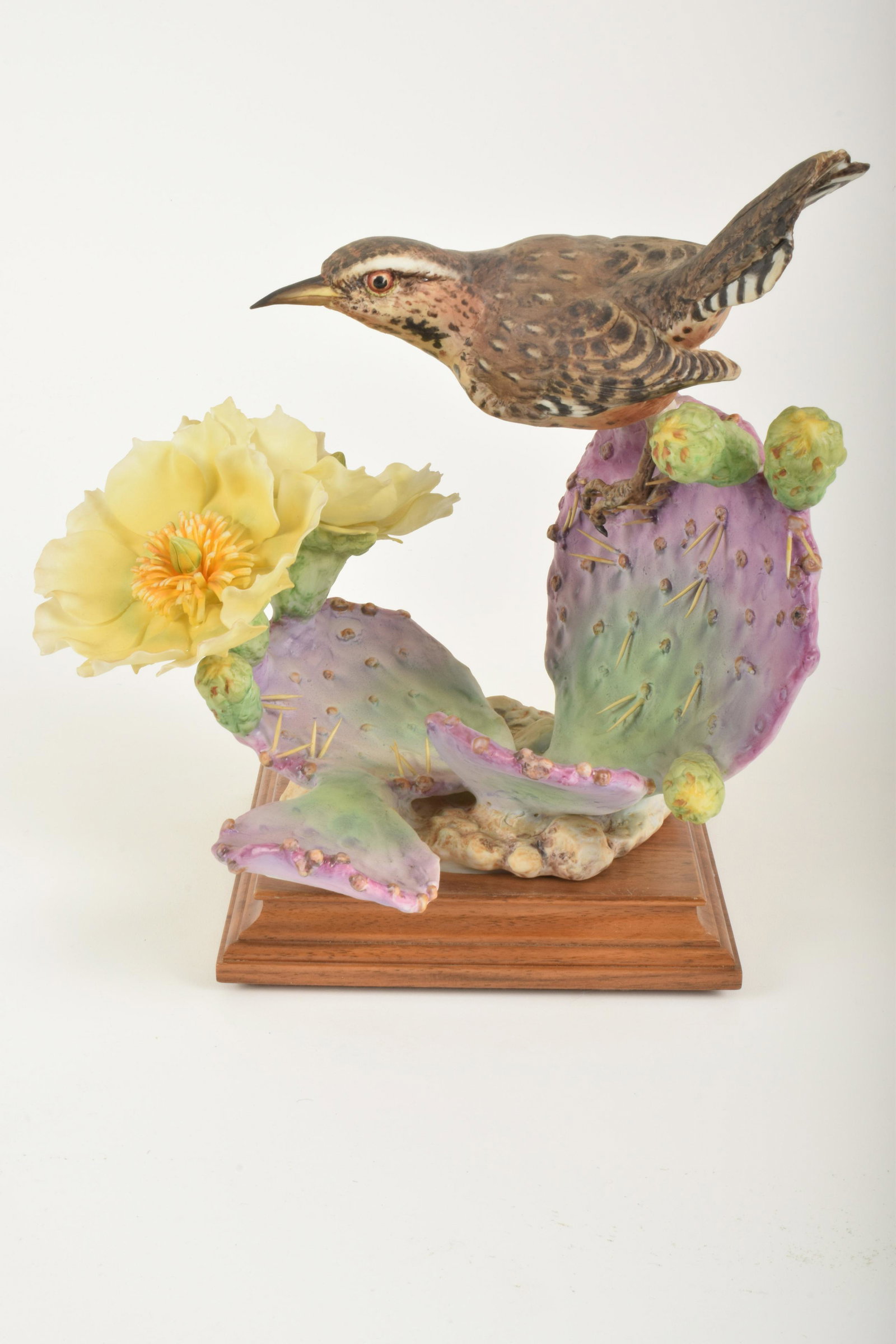 Dorothy Doughty for Royal Worcester "Cactus Wren Cock: Dorothy Doughty for Royal Worcester. Bone China "Cactus Wren Cock (tail down) and Prickly Pear," made in England. Approximately 10" high and 12" at widest point. With box. Break to cactus petal (inclu