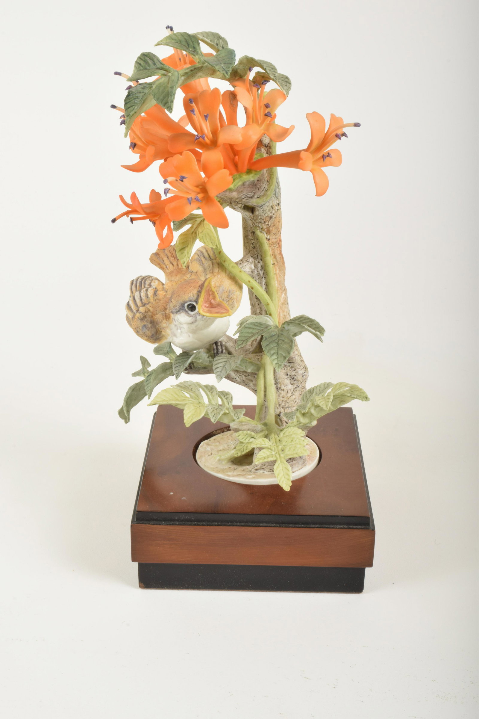 Dorothy Doughty for Royal Worcester "Phoebe Chick with: Dorothy Doughty for Royal Worcester. Bone China "Phoebe Chick with Flame Vine," made in England. Approximately 10" high and 6.25" at widest point. With box. Looseness to one set of pistils stems (inta