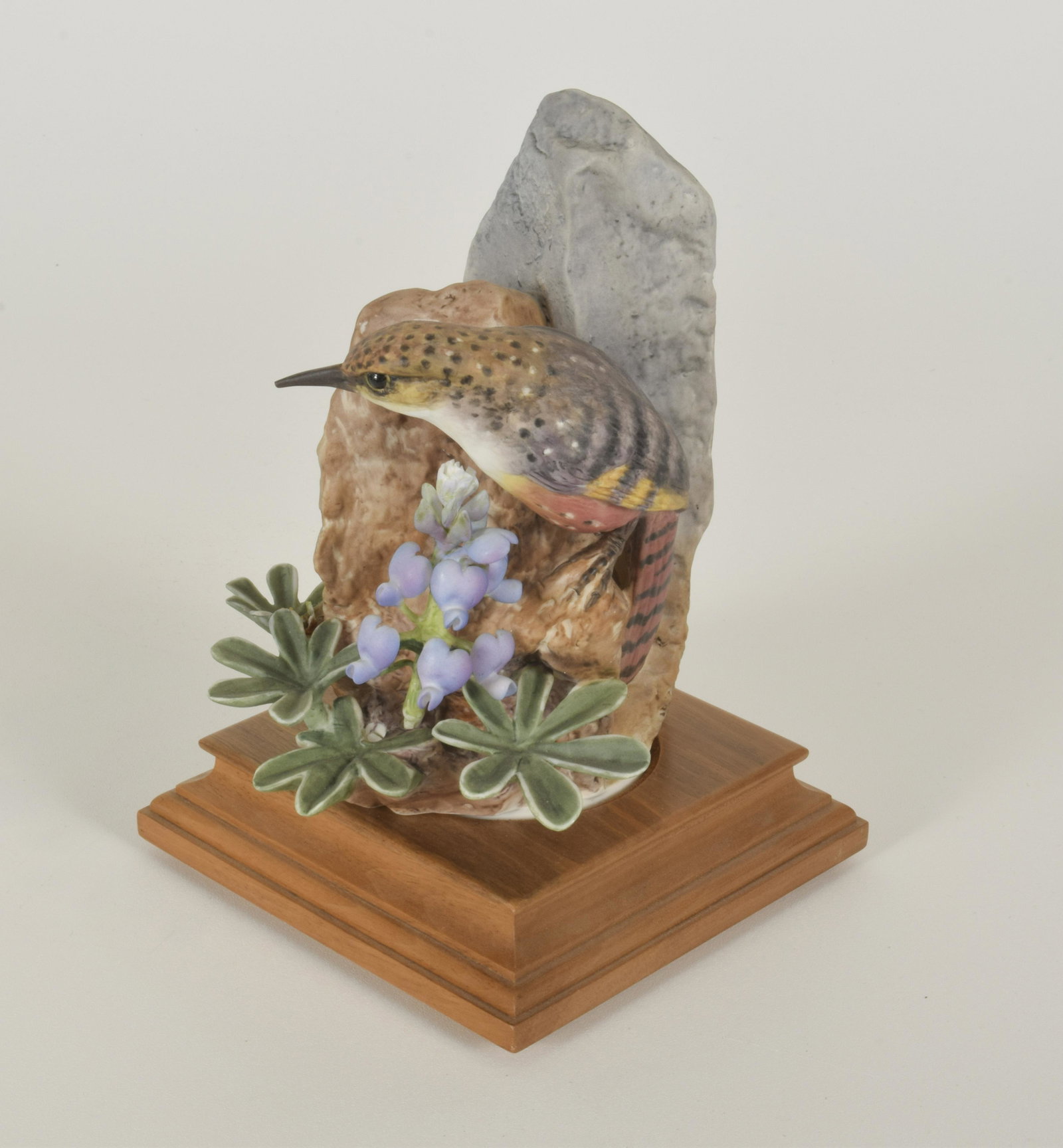 Dorothy Doughty for Royal Worcester "Canyon Wren with: Dorothy Doughty for Royal Worcester. Bone China "Canyon Wren with Wild Lupin," made in England. Approximately 7" high and 4.75" at widest point. With box. Losses, separated stem (included).