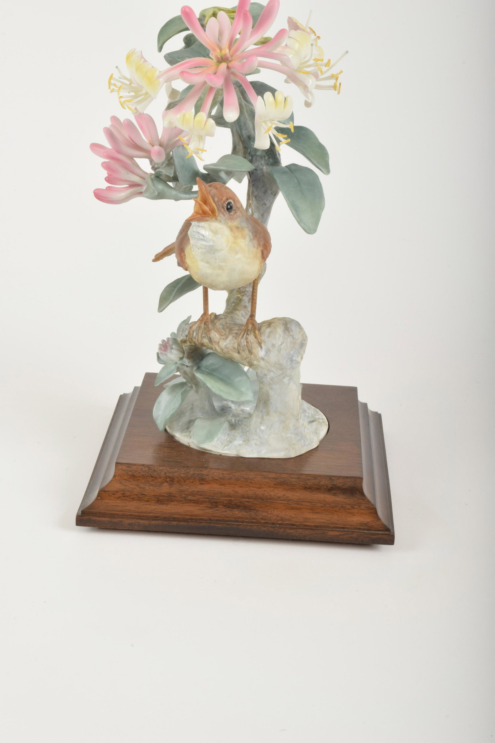 Dorothy Doughty for Royal Worcester "Nightingale with: Dorothy Doughty for Royal Worcester. Bone China "Nightingale with Honeysuckle," made in England circa 1970. Approximately 9.5" high and 7.25" at widest point. With box. Cracks to base.