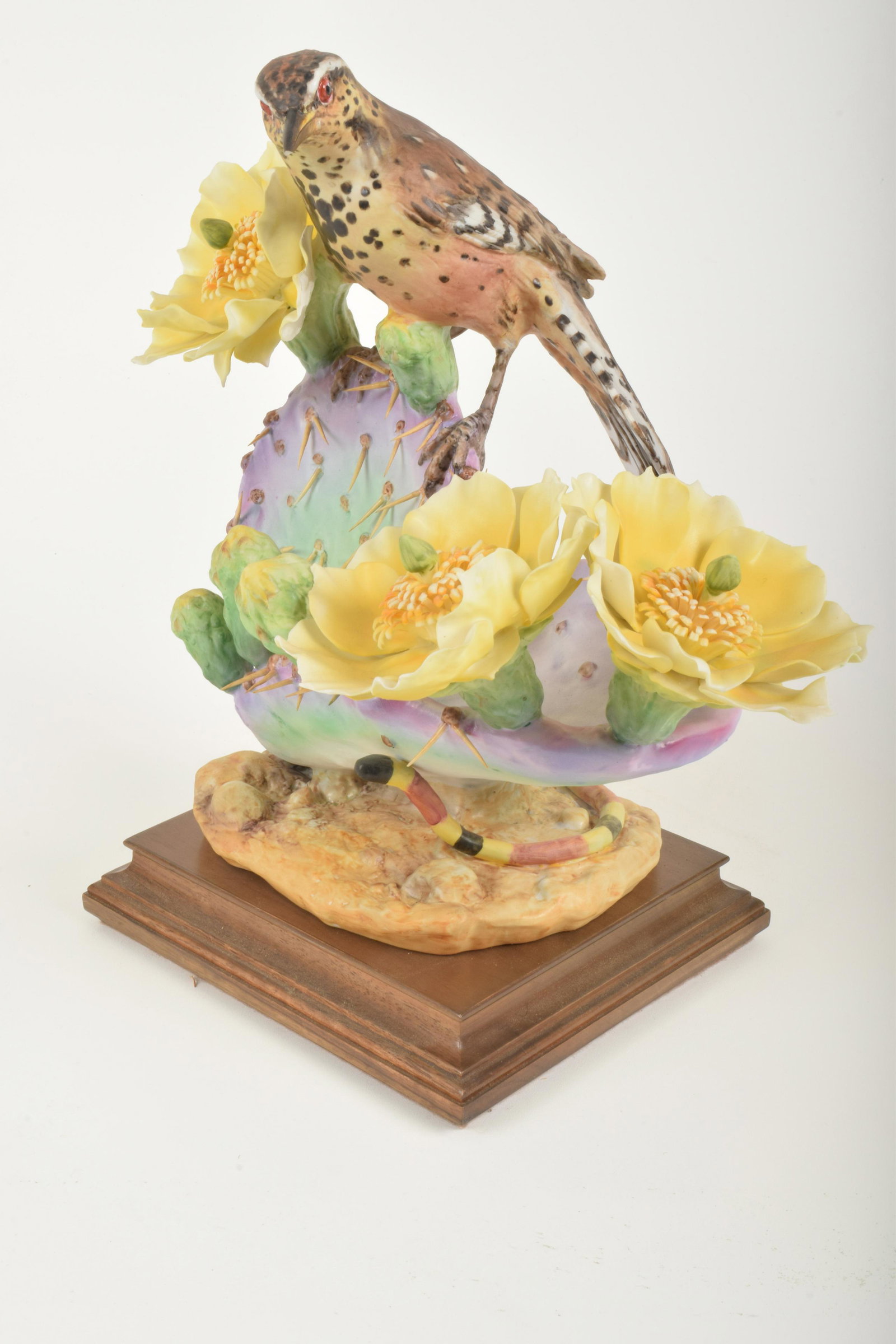 Dorothy Doughty for Royal Worcester "Cactus Wren and: Dorothy Doughty for Royal Worcester. Bone China "Cactus Wren and Prickly Pear," made in England. Approximately 10.75" high and 11" at widest point. No box. Loss to beak.