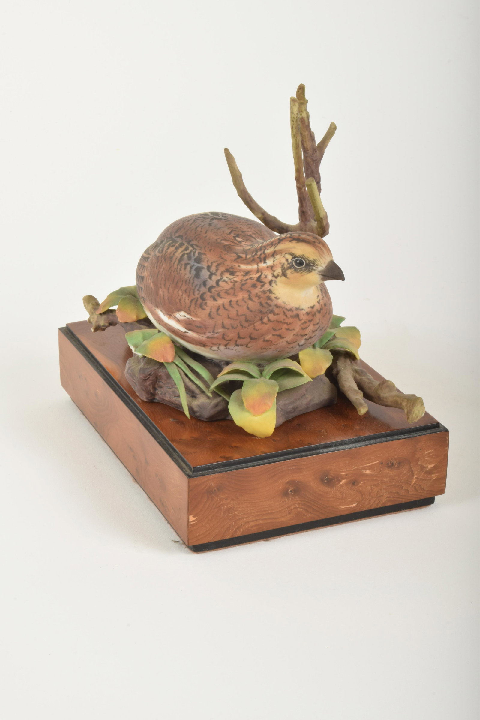 Ronald Van Ruyckevelt for Royal Worcester "Bob-White: Ronald Van Ruyckevelt for Royal Worcester. Bone China "Bob-White Quail," made in England circa 1969. Approximately 6.5" high and 7" at widest point. Included wooden base. No box. One rear leaf broken 