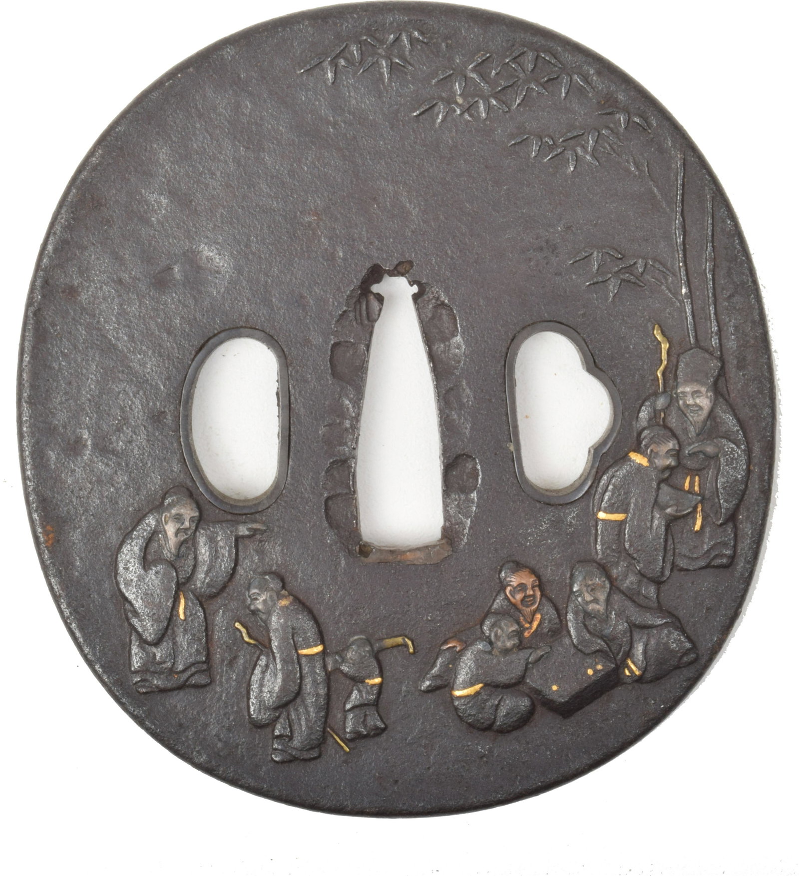 Round Iron Tsuba: Round iron tsuba. Carved in low relief with the seven sages of the bamboo grove, inlaid with copper, silver, and gold. 3” x 3 ¼”.