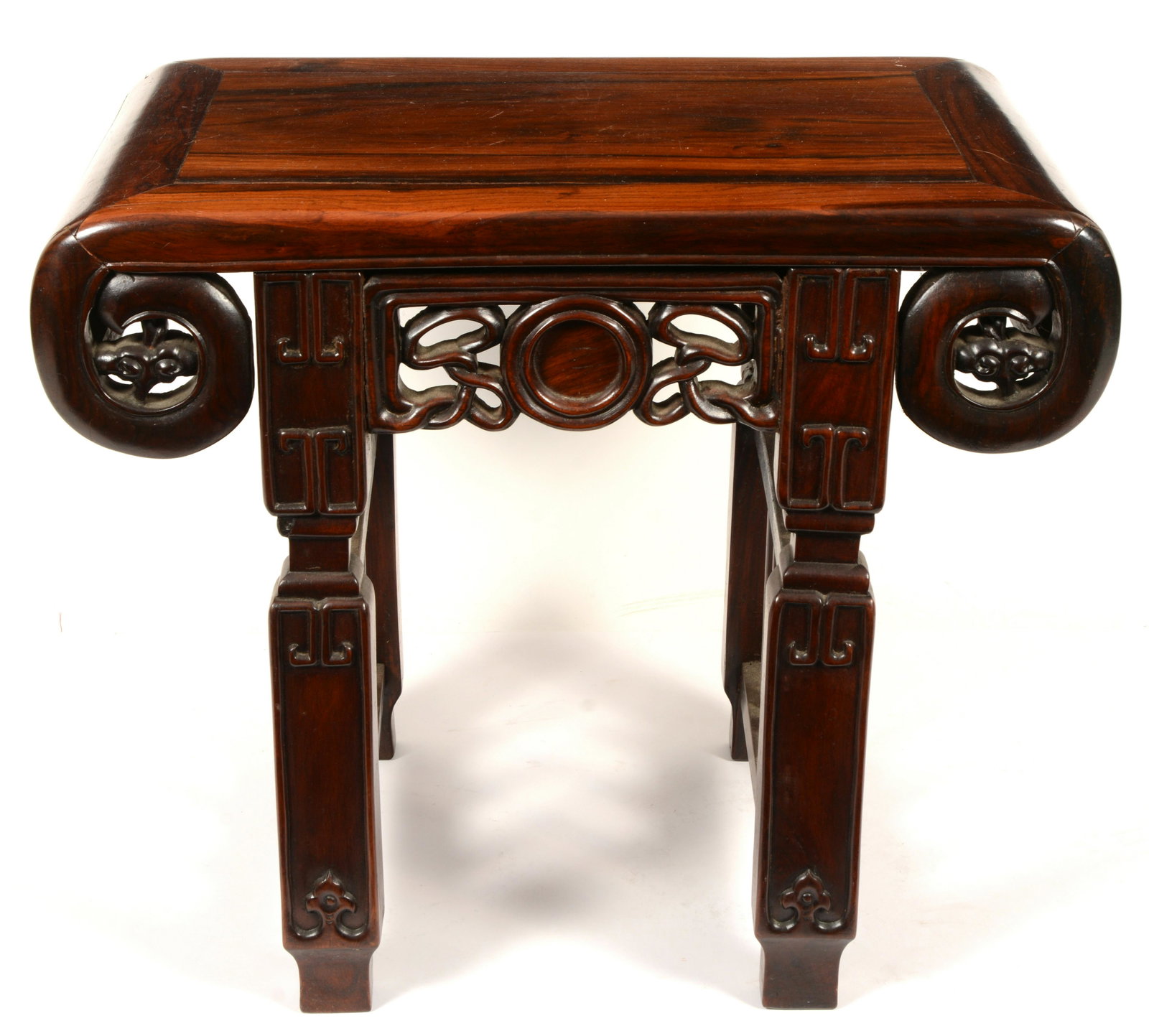 Chinese Rosewood Stool, 19th Century: Rosewood stool, China, 19th Century. Open scroll form with ju-i aprons and ling chih.20” width x 17 ½” Height x 13 1/2” Diameter