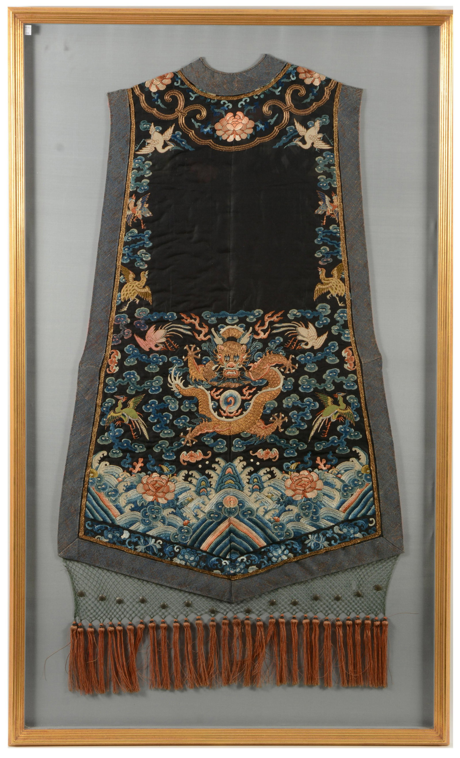 Chinese Court Vest with Dragons and Cranes: Court vest. China. 19 th Century. Black ground embroidered with dragons and cranes. Framed and glazed. 59” high x 36” wide of frame.
