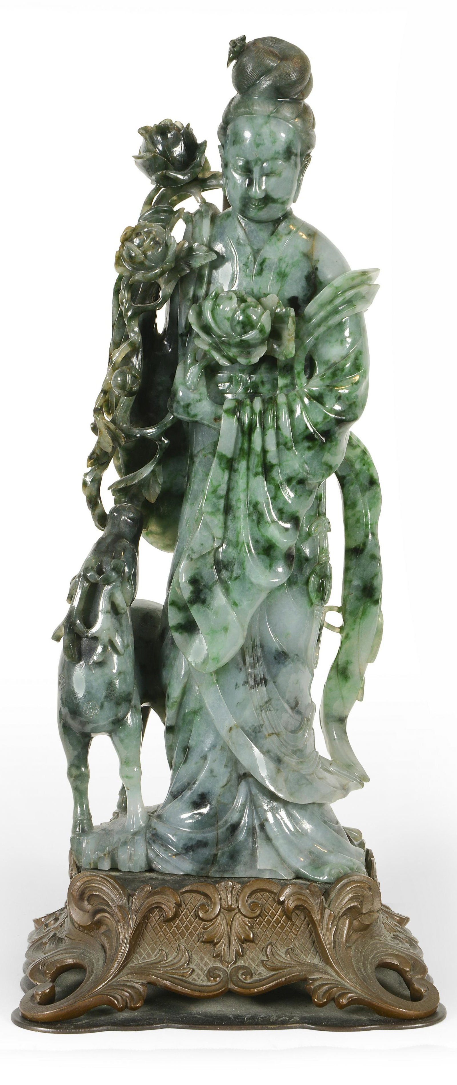 Impressive Jadeite Carving of Hsi Wang Mu: Jadeite carving, China, 19th Century. Figure of Hsi Wang Mu with a deer and flowers. Lavender blue color with bright and emerald green areas. Highly translucent stone. 16” high for just the jade car