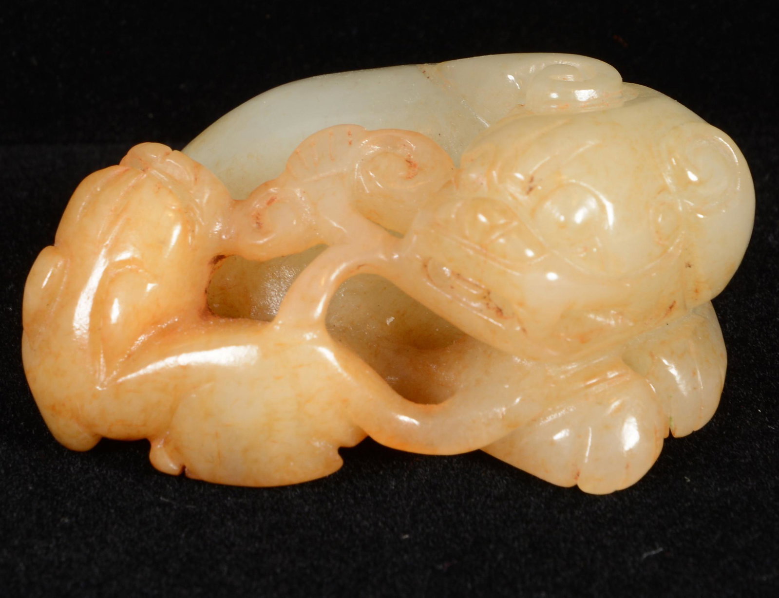 Jade Figural Carving, 19th Century: Jade carving. China. 19 th Century. Yellow stone. Carving of a foo dog, cub and ling chih. 1-3/4” long.