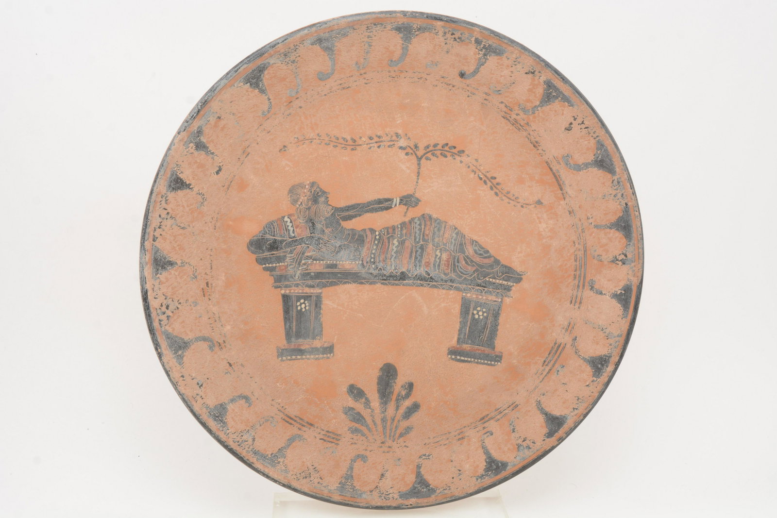 Grand Tour Ancient Greek Style Terracotta Charger: Large Grand Tour Ancient Greek style terracotta pottery charger with black and red reclining figure. Encrusted with dirt. 17-½” diameter.
